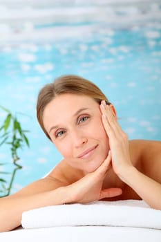 Closeup of beautiful blond woman on a massage bed