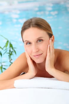 Closeup of beautiful blond woman on a massage bed