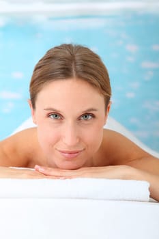 Closeup of beautiful blond woman on a massage bed