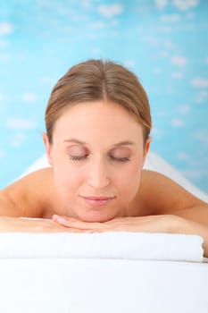 Closeup of beautiful blond woman on a massage bed