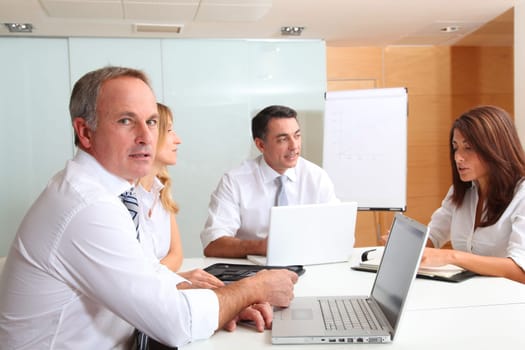 Business people meeting around table