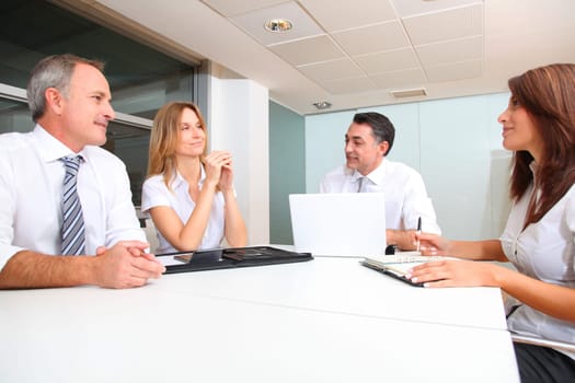 Business people meeting around table