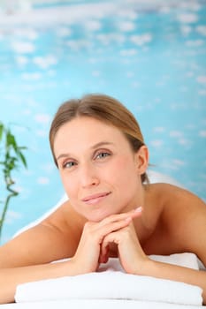 Closeup of beautiful blond woman on a massage bed