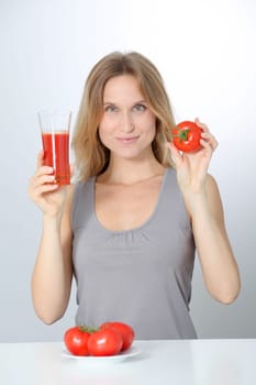 Woman drinking tomato juice