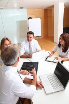 Business people meeting around table