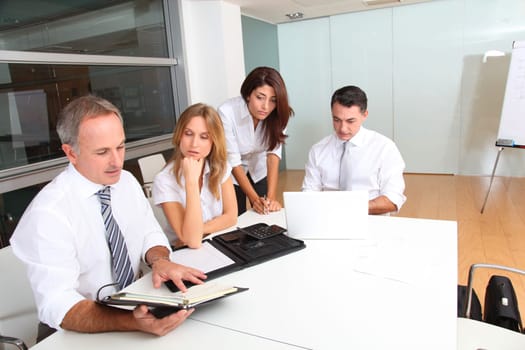 Business people meeting around table