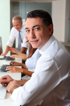 Portrait of smiling businessman in a meeting