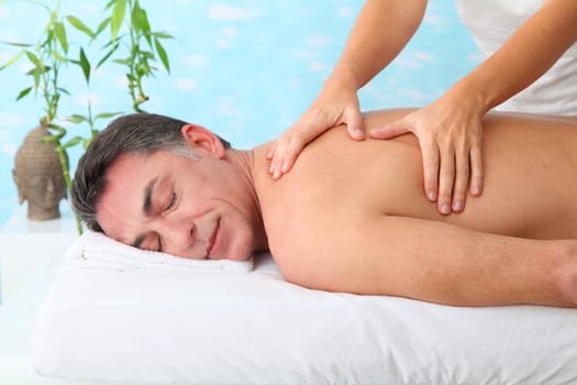 Man having a massage in a spa center