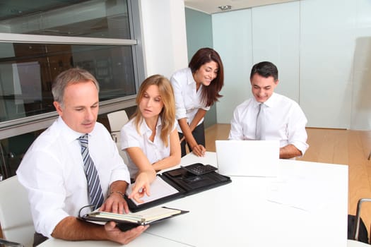 Business people meeting around table
