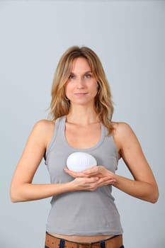 Woman holding stone with message