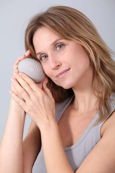 Woman holding stone with message