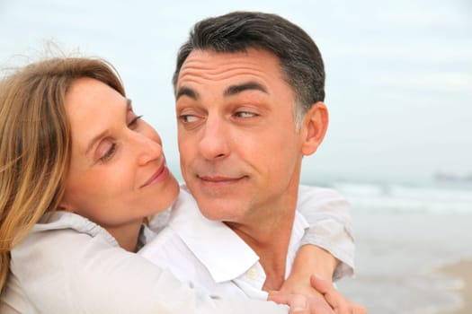 Couple embracing each other at the beach