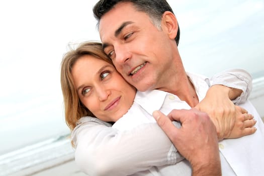 Couple embracing each other at the beach