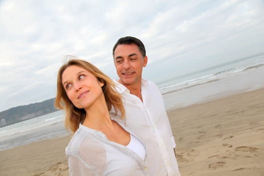 Couple walking by the beach