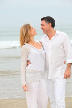 Couple walking by the beach