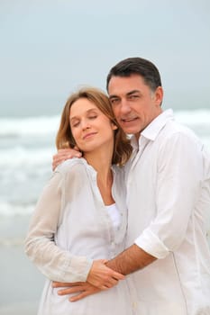 Couple walking by the beach