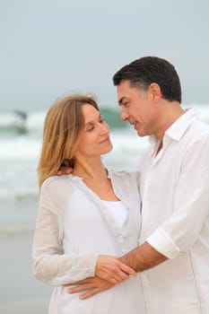 Couple walking by the beach
