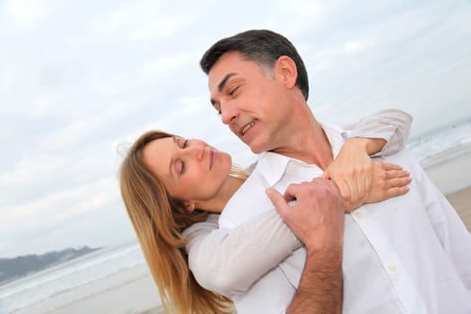 Couple embracing each other at the beach