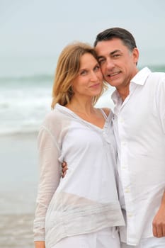 Couple walking by the beach