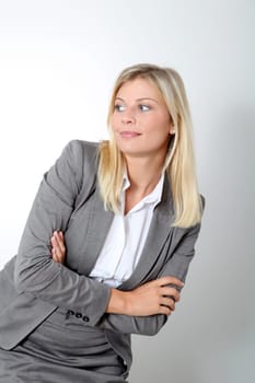 Blond businesswoman doing expressions on white background