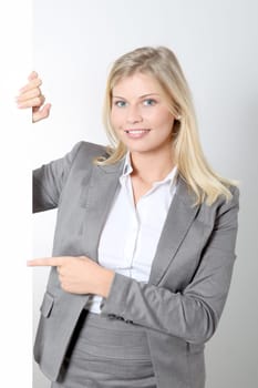 Businesswoman holding white panel