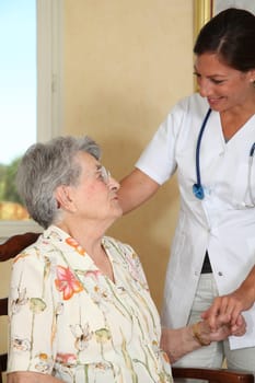 Elderly person with nurse