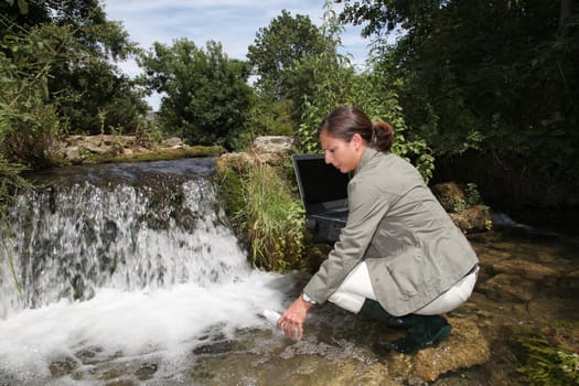 Biologist testing quality of water