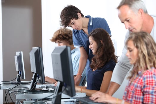 Teenagers in computing class
