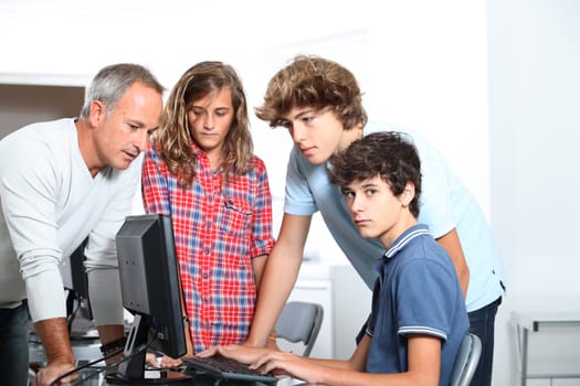 Teenagers in computing class