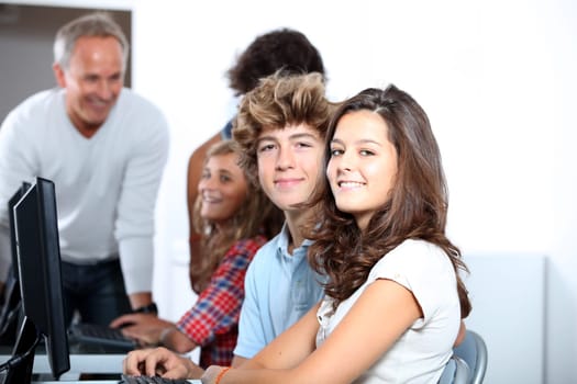 Teenagers in computing class