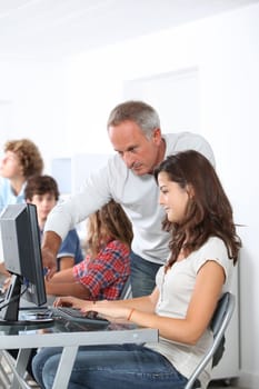 Teacher with student in classoom