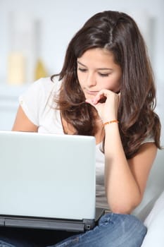 Closeup of teenager girl with laptop computer