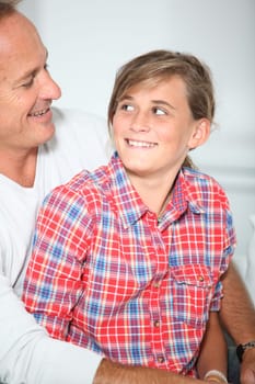 Closeup of father and daughter at home