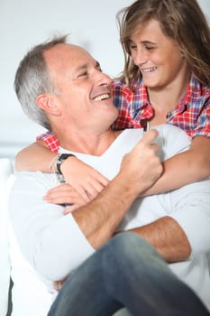 Closeup of father and daughter at home