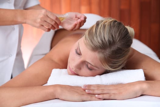 Closeup of beautiful woman laying on a massage bed