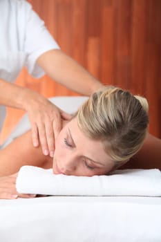 Closeup of beautiful woman laying on a massage bed