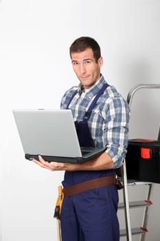 Plumber standing on white background