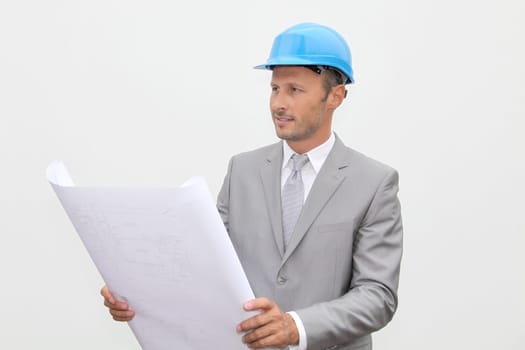 Businessman with security helmet on white background