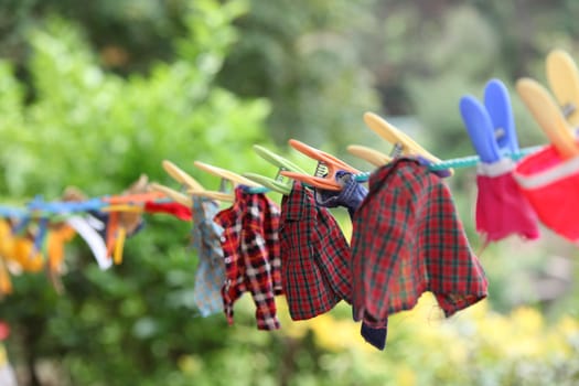 Doll clothes drying on clothes line