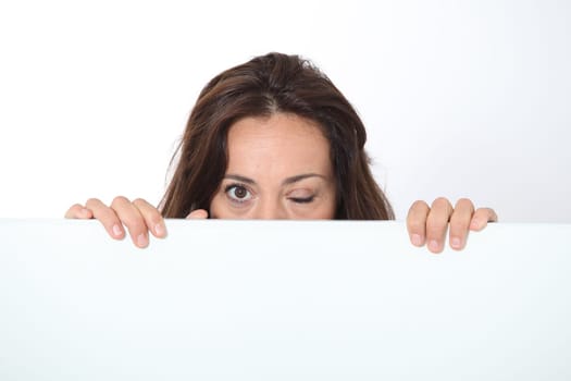 Woman showing white board on white background