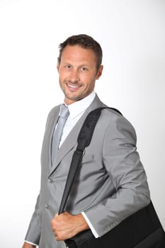 Businessman holding briefcase on shoulder