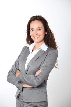 Smiling businesswoman with arms crossed