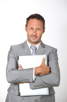 Businessman carrying laptop computer