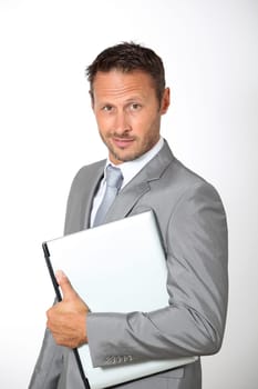Businessman carrying laptop computer