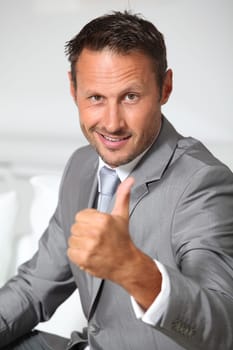 Businessman with thumb up