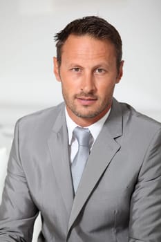Closeup of businessman wearing grey suit
