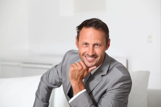 Closeup of businessman wearing grey suit