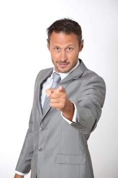 Businessman pointing at camera