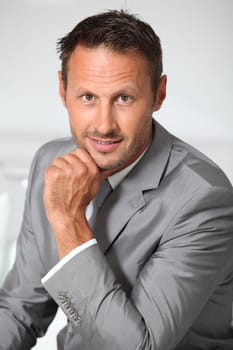 Closeup of businessman wearing grey suit