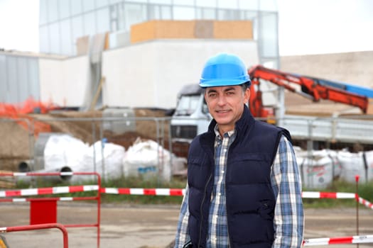 Engineer on construction site with security helmet